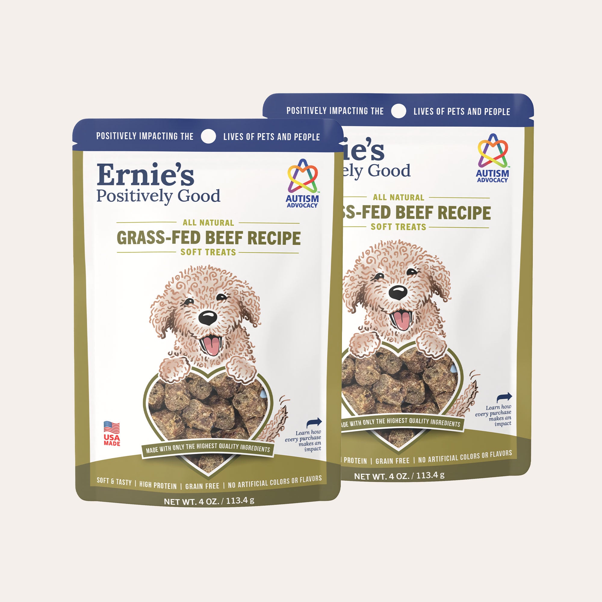 Two packages of Ernie's Positively Good grass-fed beef recipe dog treats.