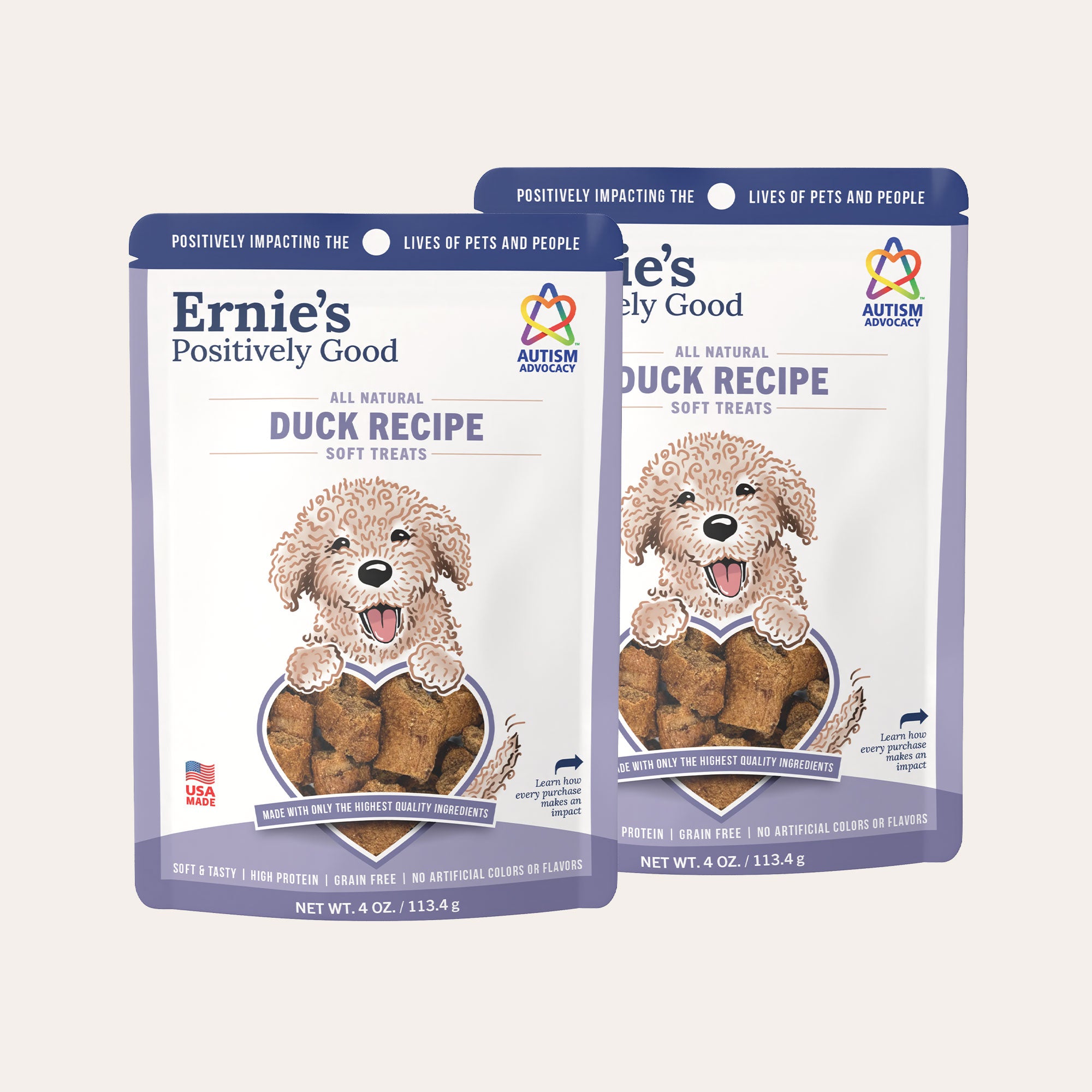 Two packages of Ernie's Positively Good duck recipe dog treats.