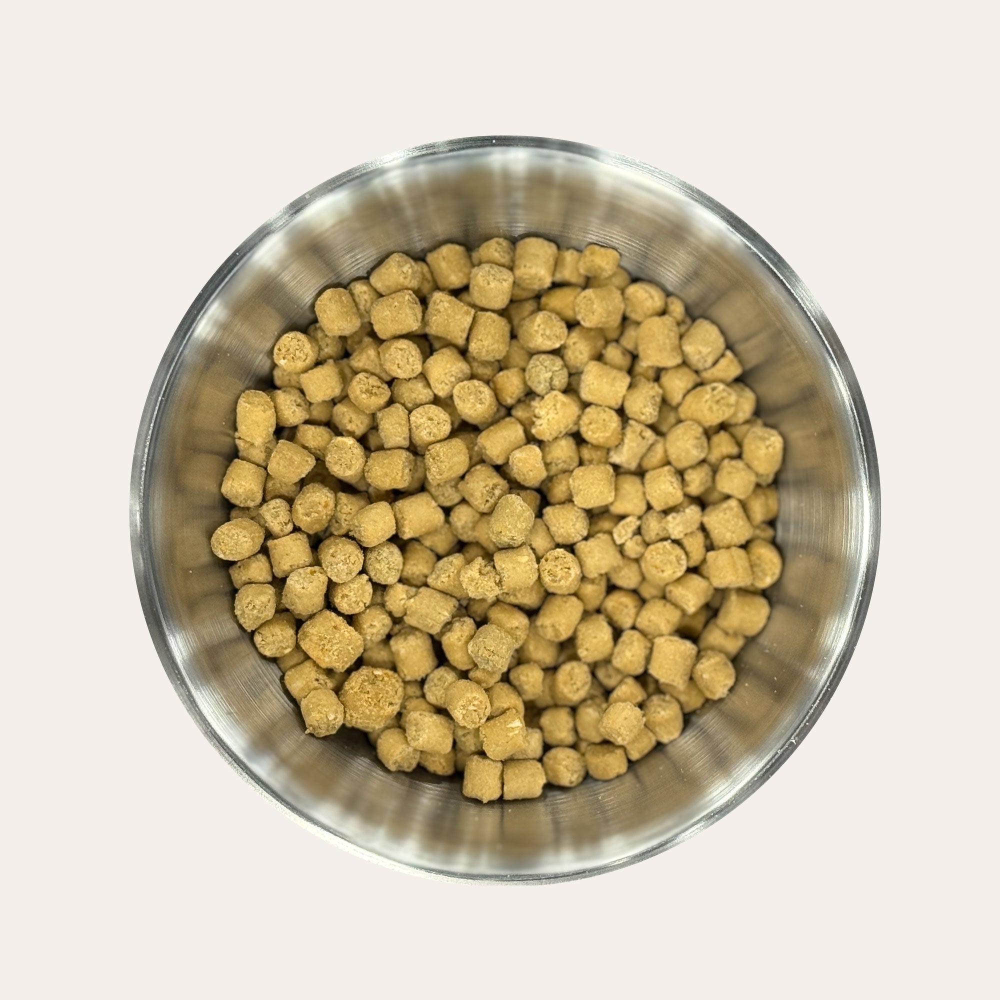 Metal bowl filled with Ernie's Positively Good Salmon Recipe Morsels cat treats.