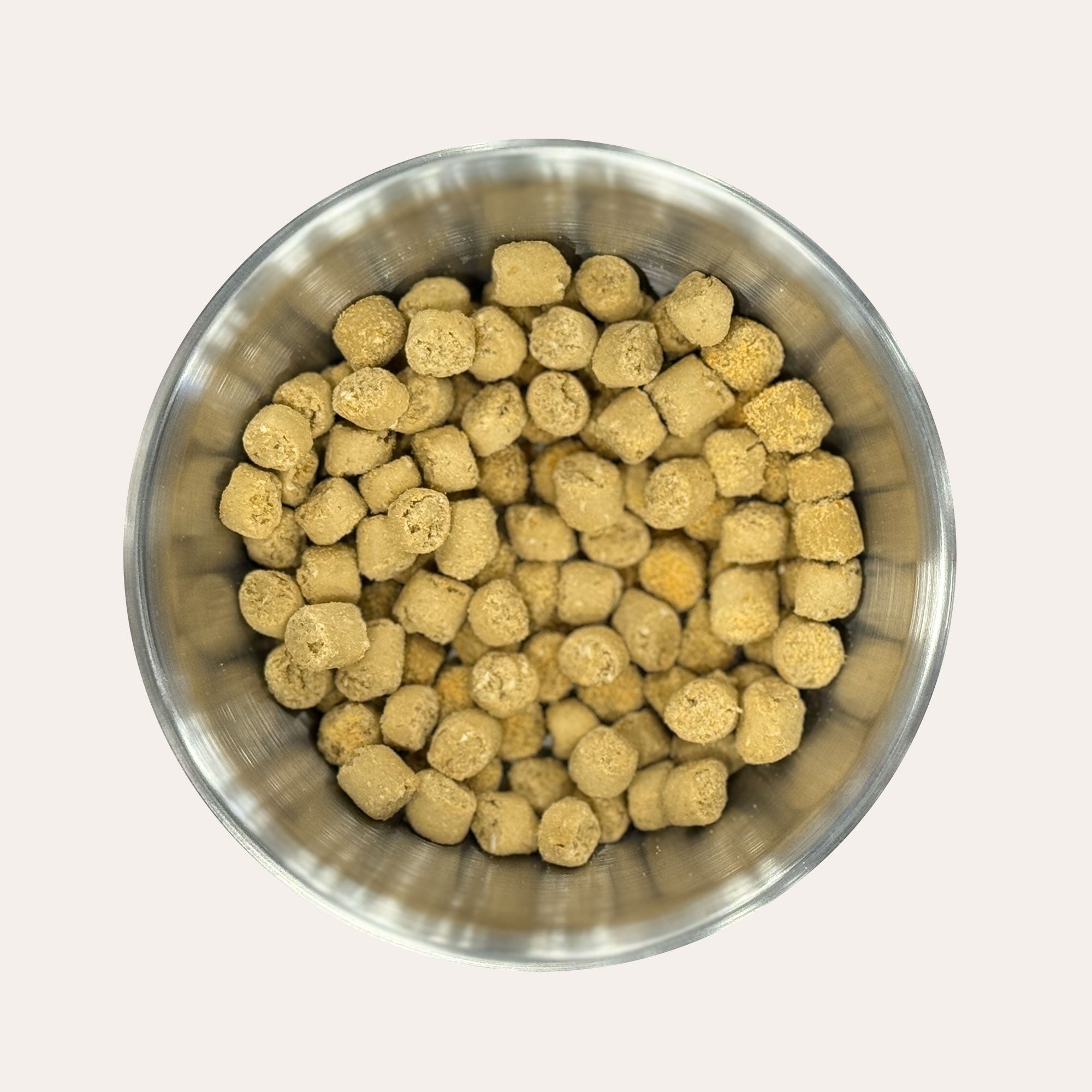 Metal bowl filled with Ernie's Salmon Recipe Nuggets dog treats.